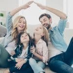 a family sitting on the floor