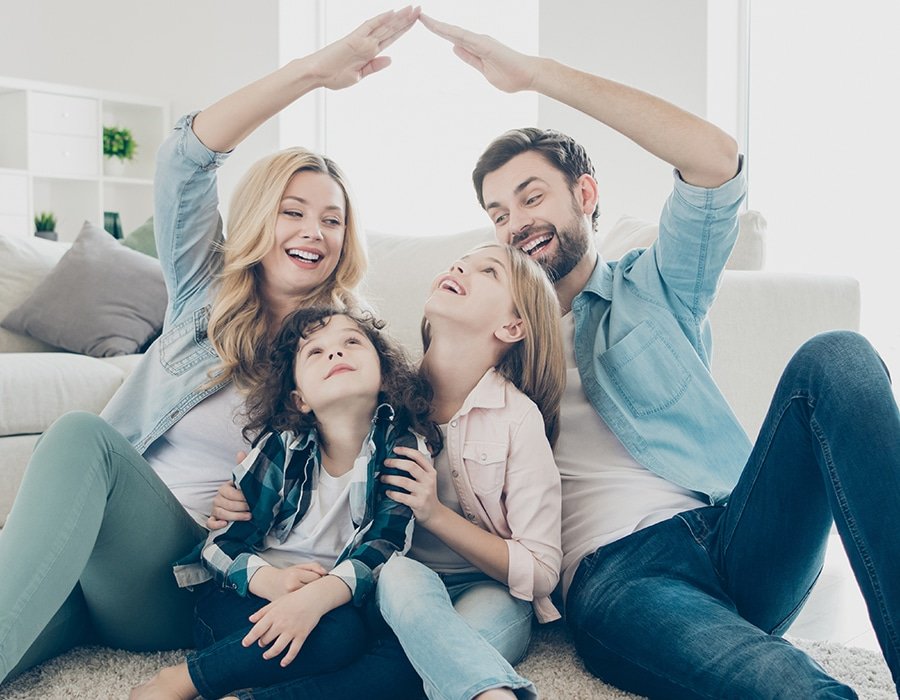 a family sitting on the floor